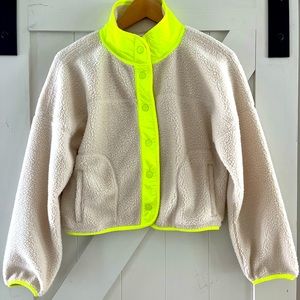 Oatmeal colored Sherpa with neon trim/ detail. Hardly worn, like new.
